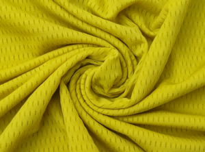 Close-up of yellow performance mesh fabric