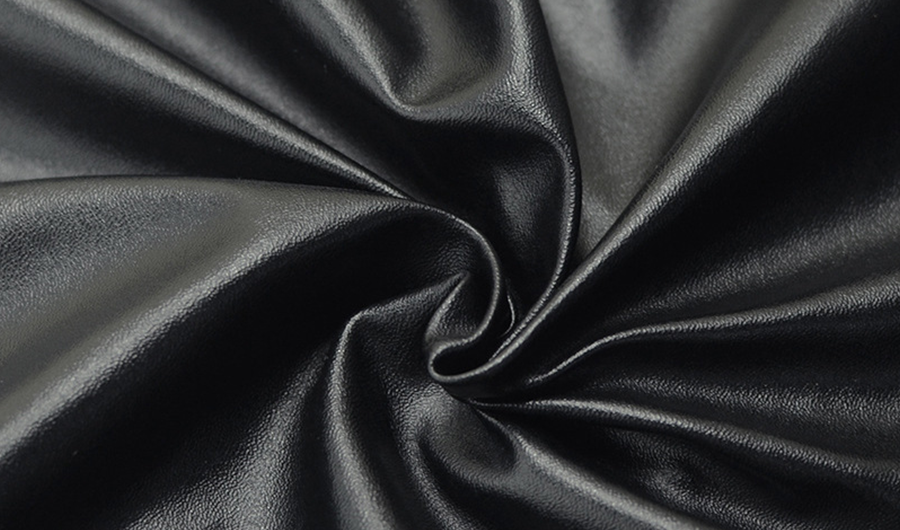 Close-up of smooth black synthetic fabric
