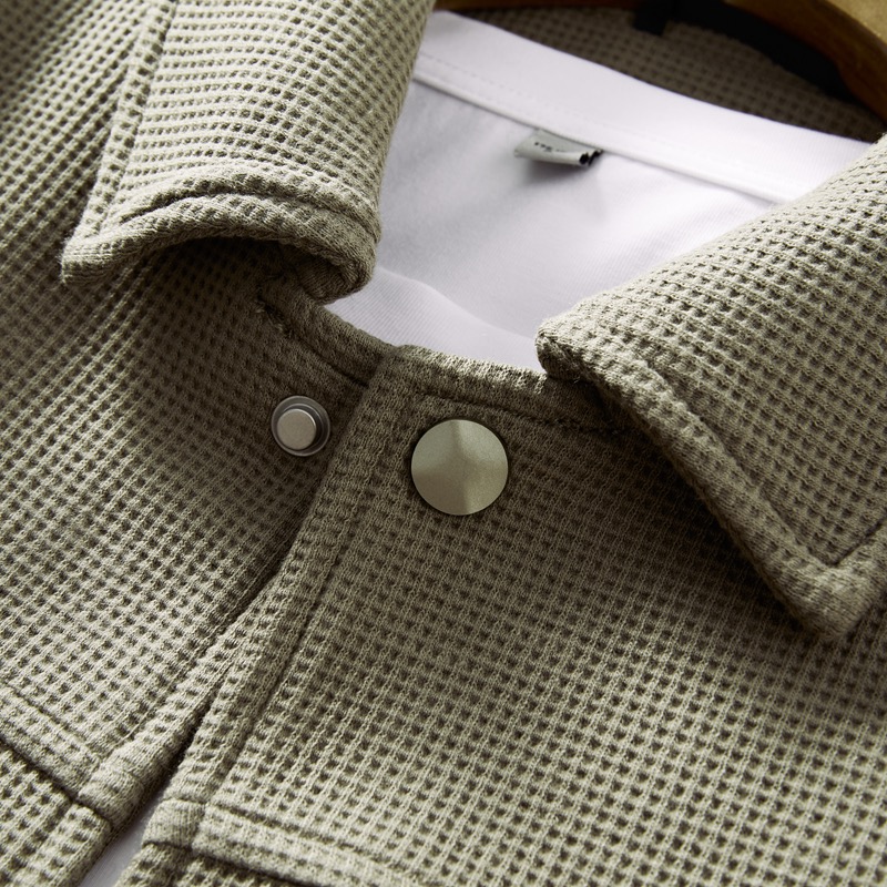 Snap button detail on knit apparel