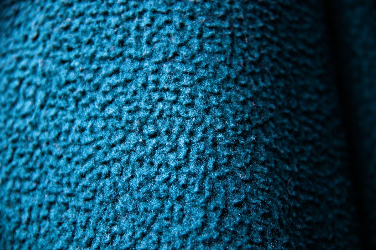 Close-up reference of blue wool textile surface